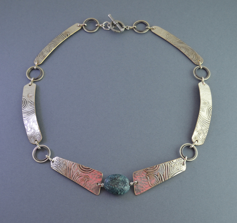 Arc Necklace of Embossed Silver Plate with Center Turquoise Stone and Silver Rings